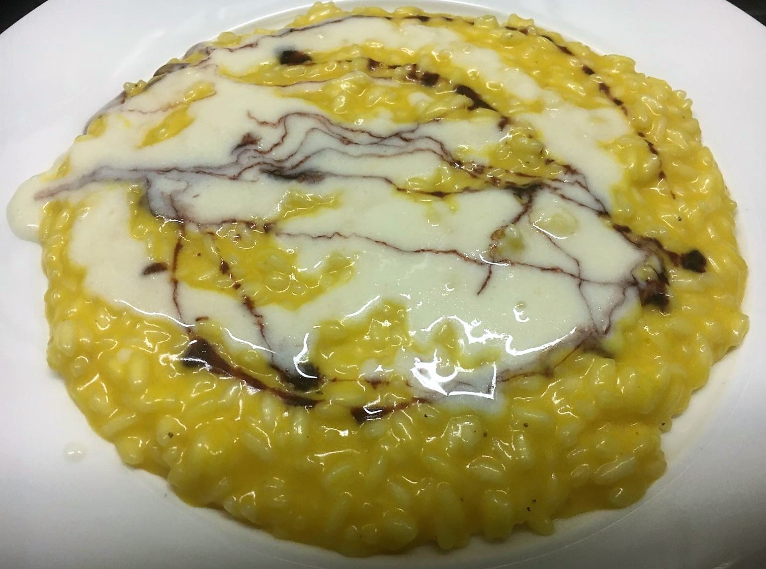 risotto alla zucca e zenzero con fonduta di pecorino rigato sardo e riduzione di vino rosso